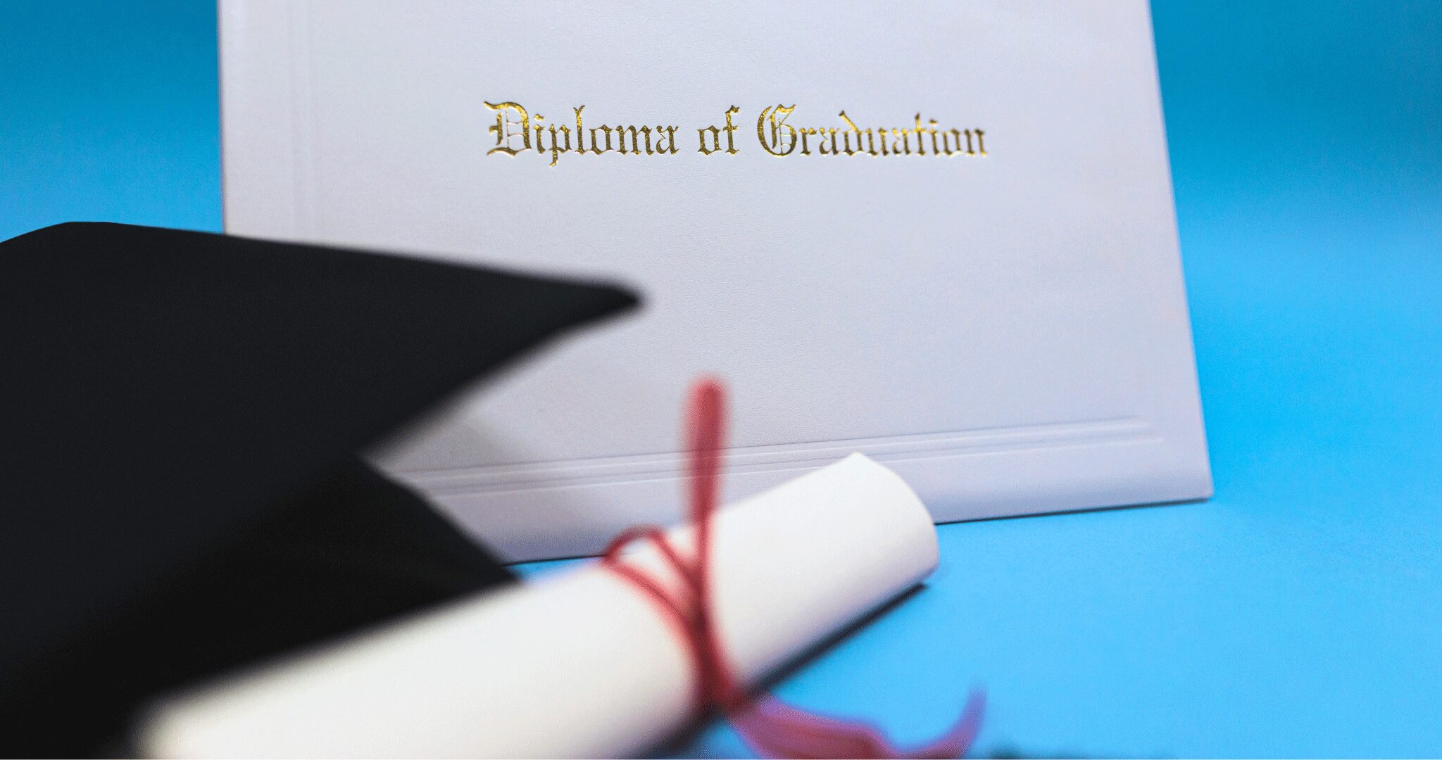 An image of a Gradiation Diploma with a graduation cap on a blue background