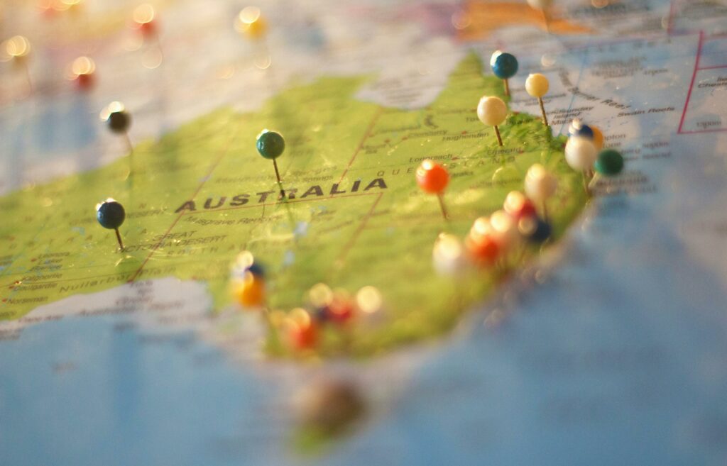 Australia Map with different colored pins, Genuine Student Requirement